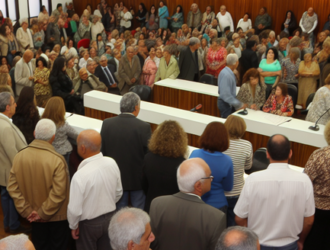 A large group of people congregating in a courtroom