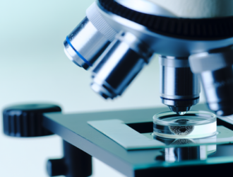 A microscope analyzing the sample of contaminated groundwater