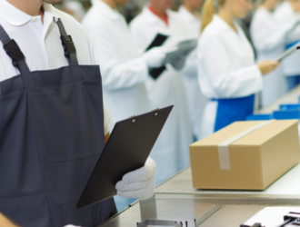 A manufacturers' assembly line with workers diligently performing quality checks