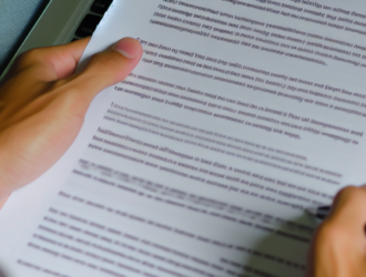 An individual carefully reading terms and conditions online to avoid potential scams