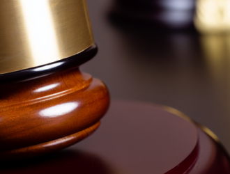 Close up on a gavel and block inside a courtroom