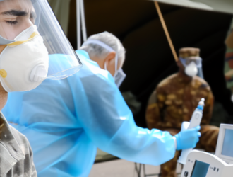 Military personnel being tested for exposure to harmful substances in a medical camp